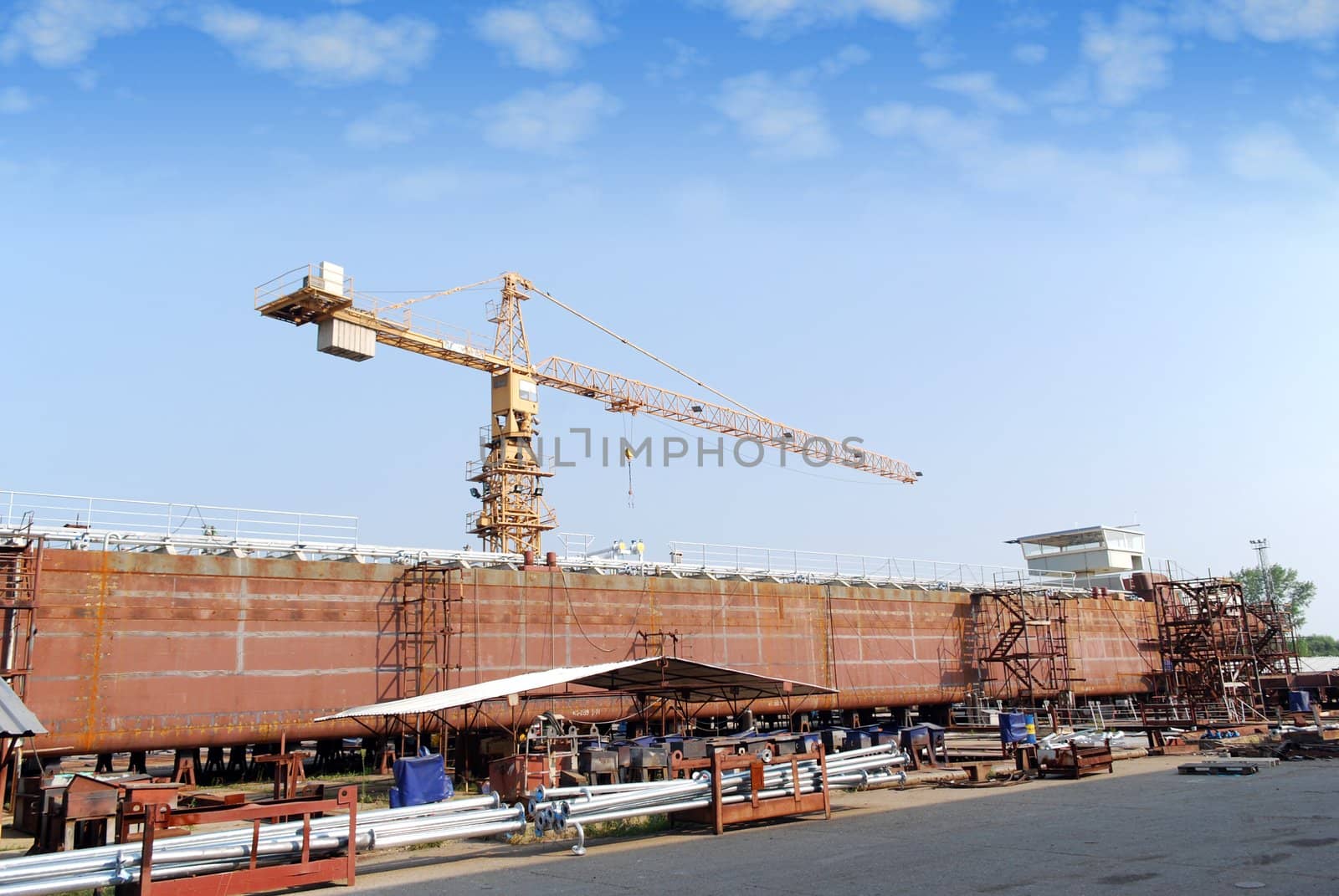 Shipyard with crane and tanker