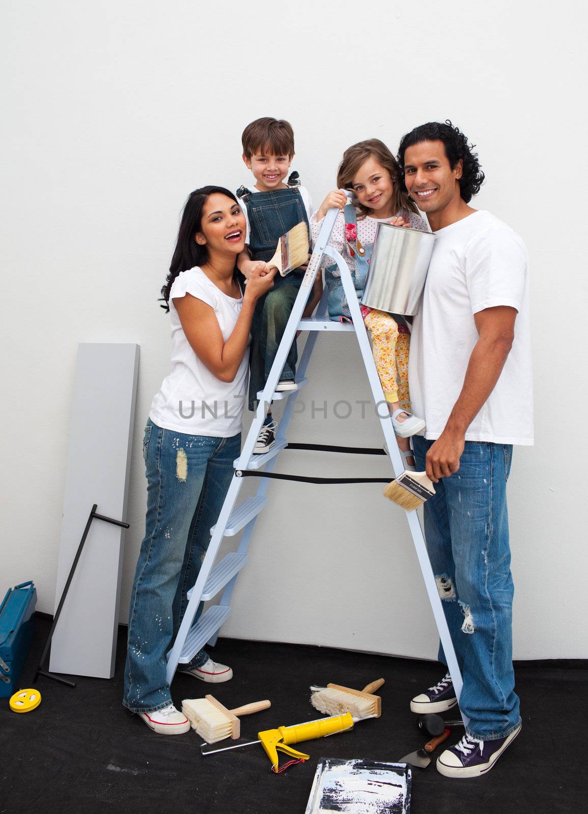 Happy young family renovating a room  by Wavebreakmedia