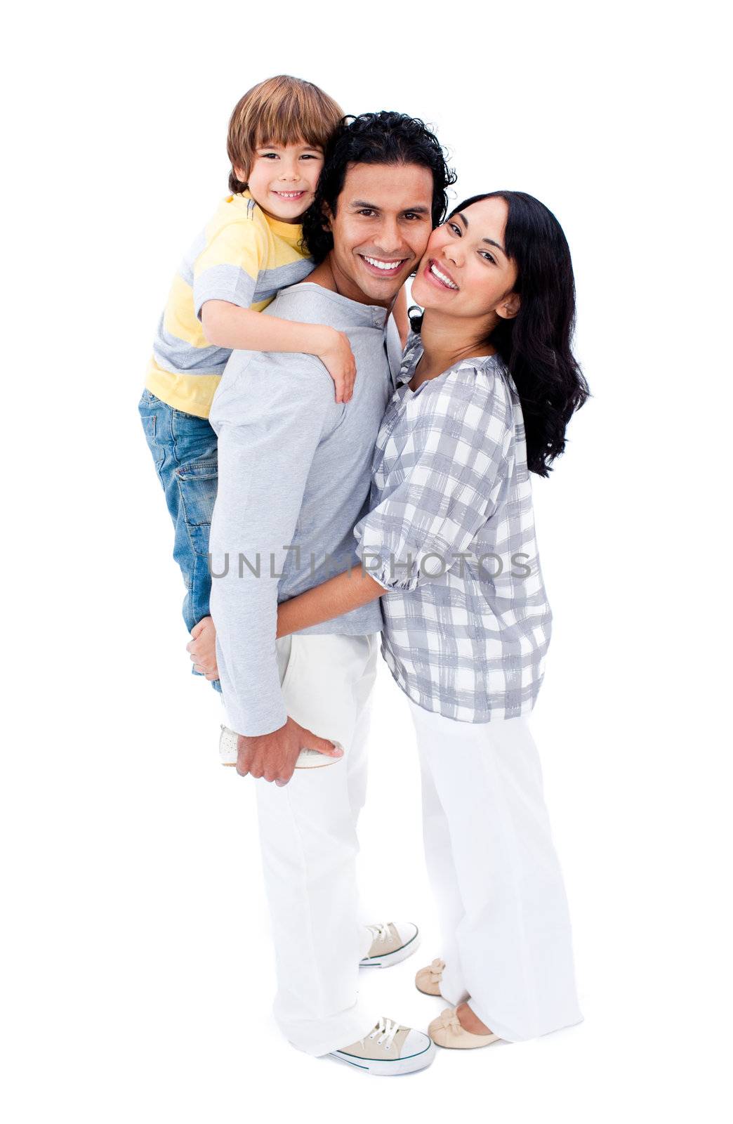 Joyful family hugging each other against a white background
