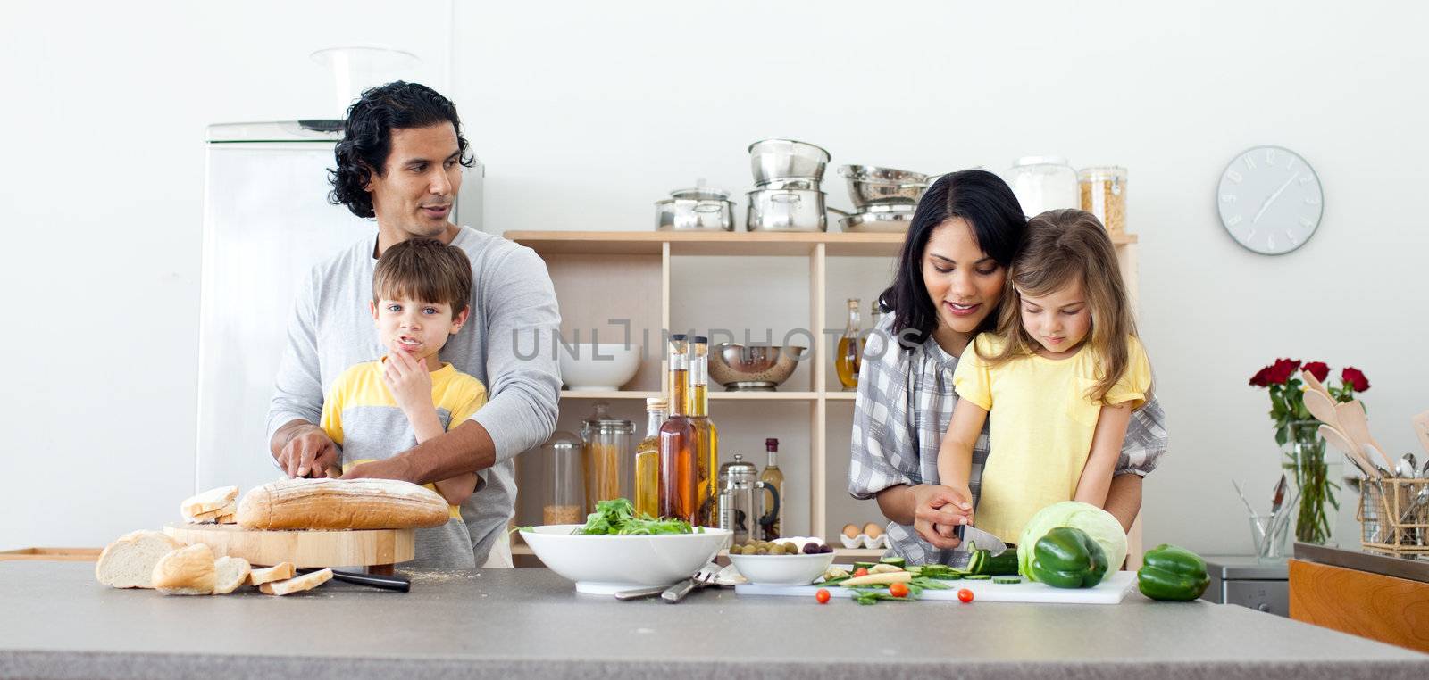Portrait of a family preparing lunch by Wavebreakmedia