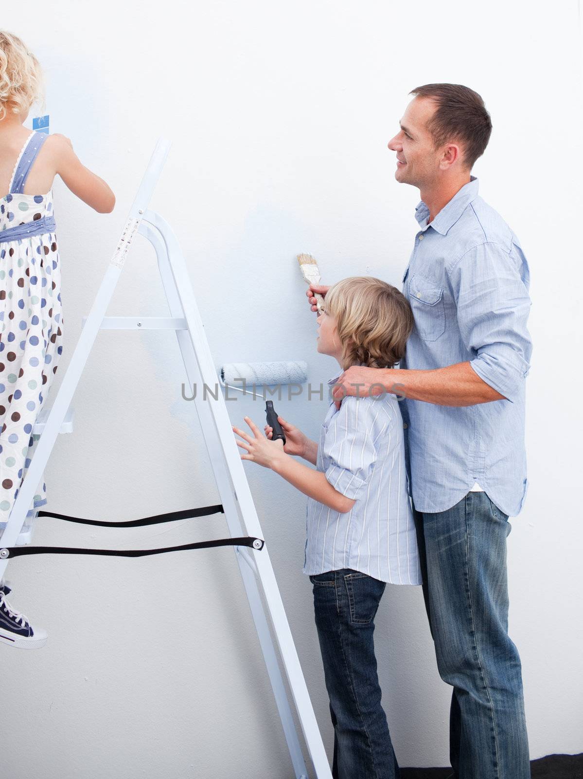 Children and parents preparing a new decoration  by Wavebreakmedia