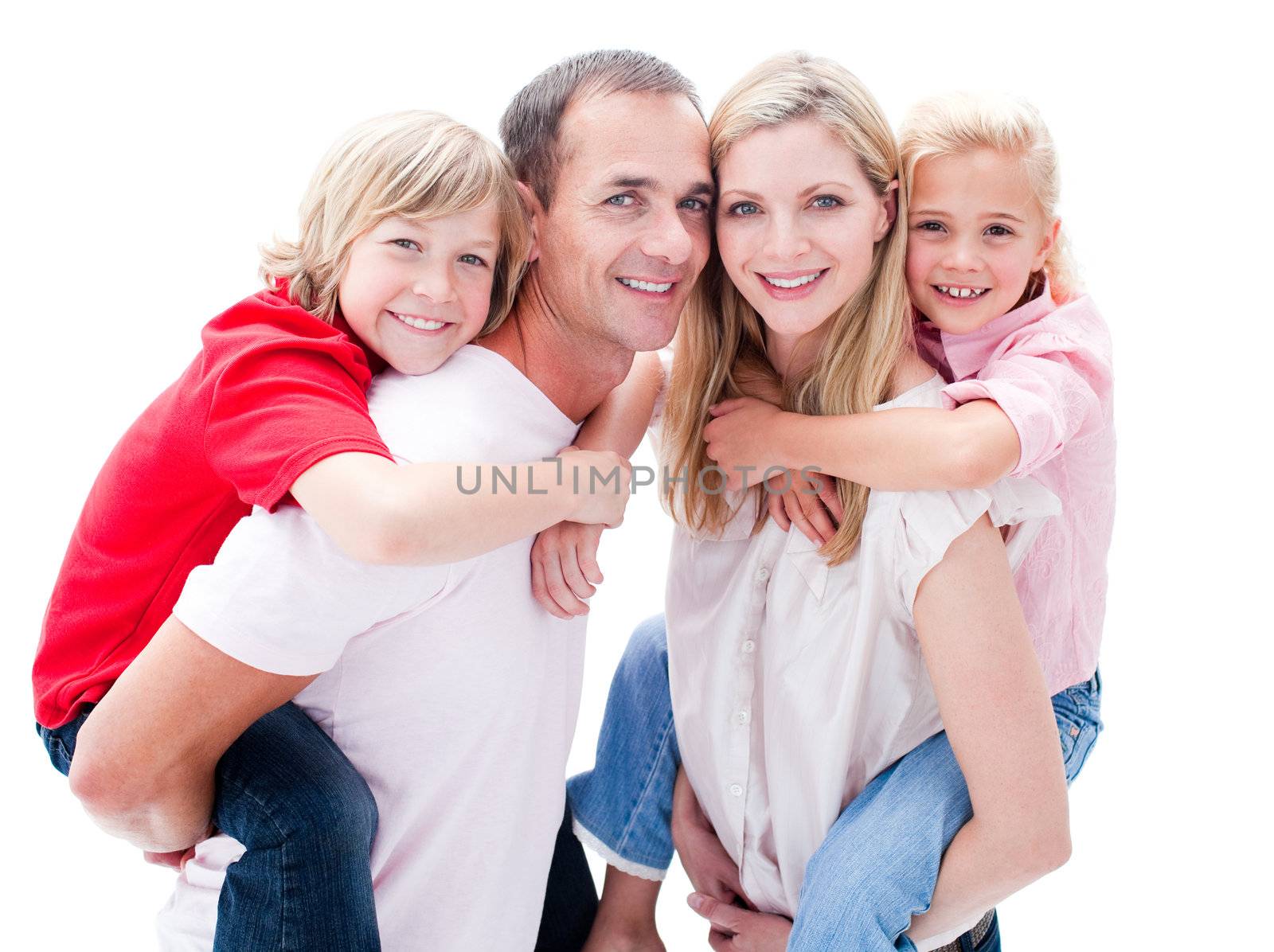 Portrait of parents giving their children piggyback ride against a white background