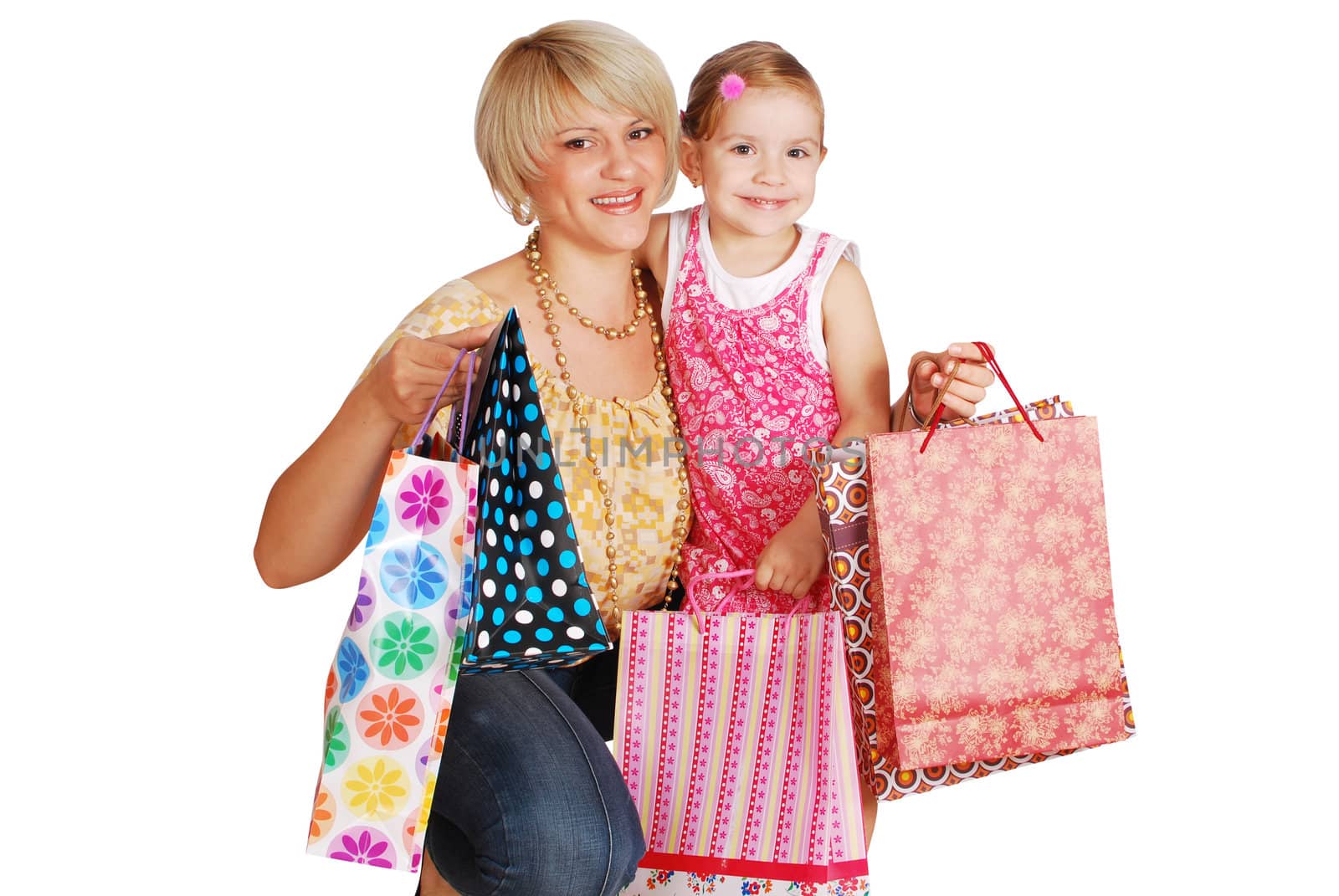 Happy mother and daughter with shopping bags studio shot