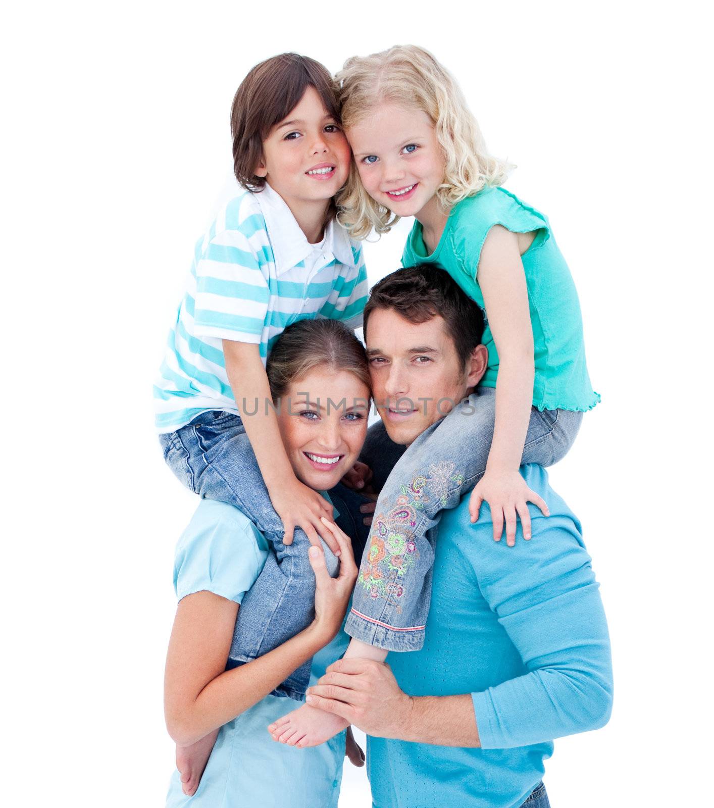 Loving parents giving their children piggyback ride against a white background