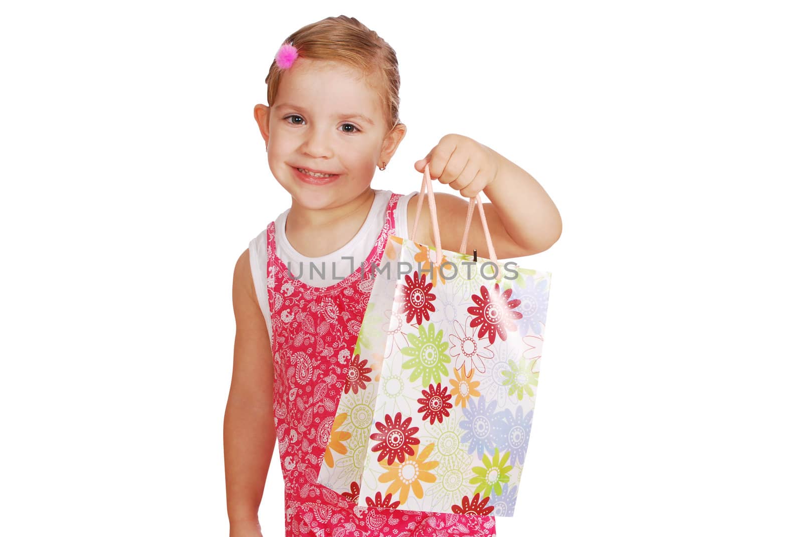 Little girl holding shopping bags studio shot