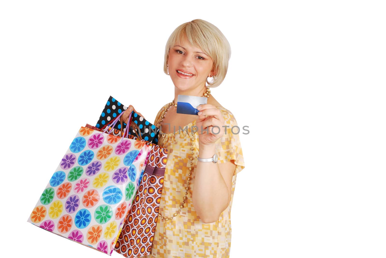 Woman with credit card and shopping bags studio shot