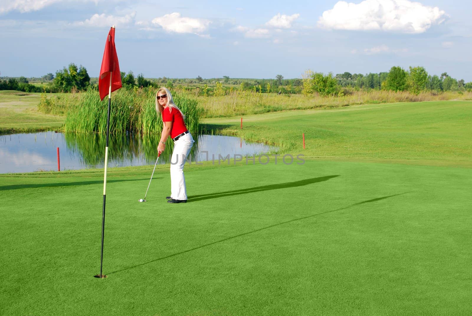 Girl golf player on golf field