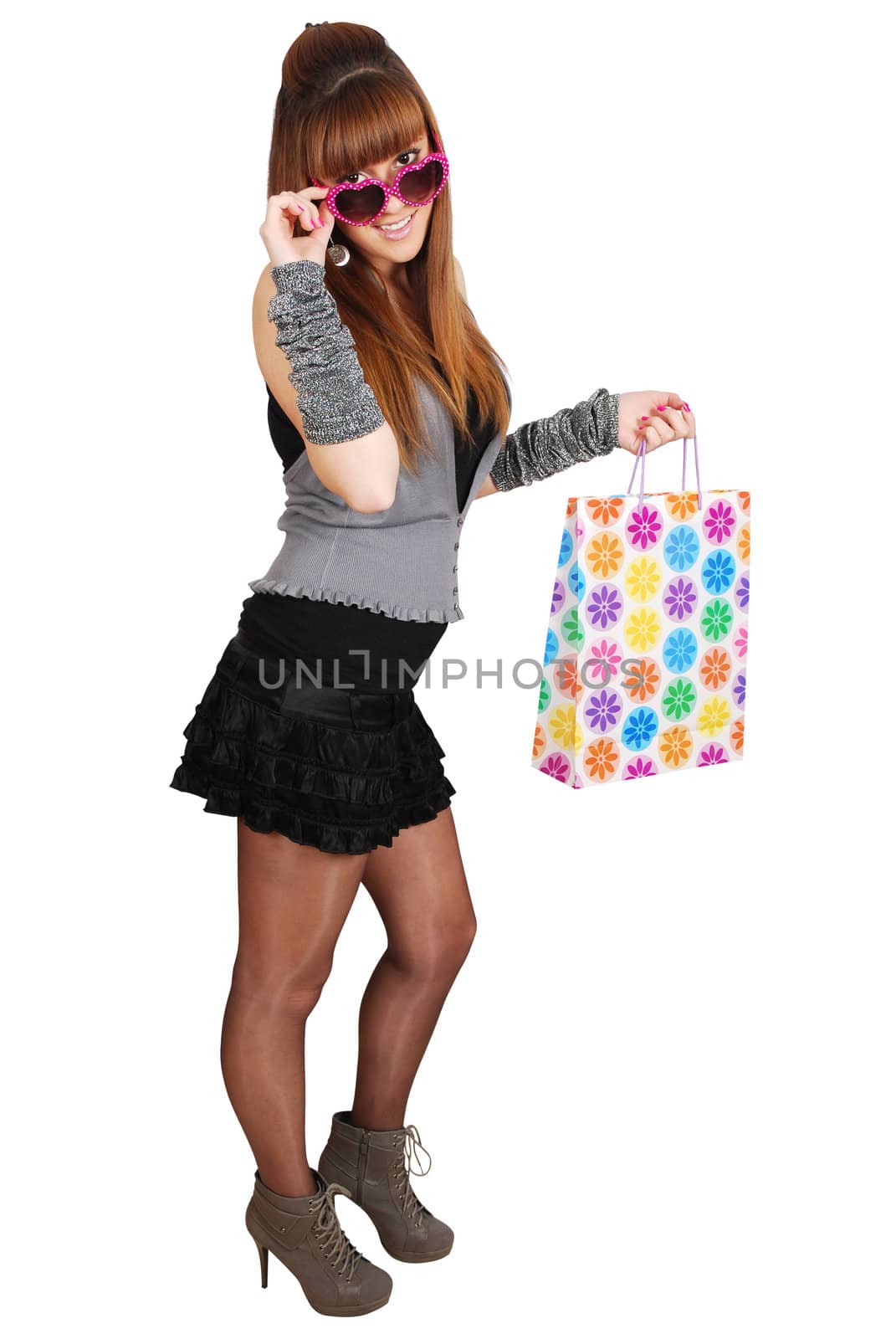 Beauty girl with shopping bag and heart sunglasses