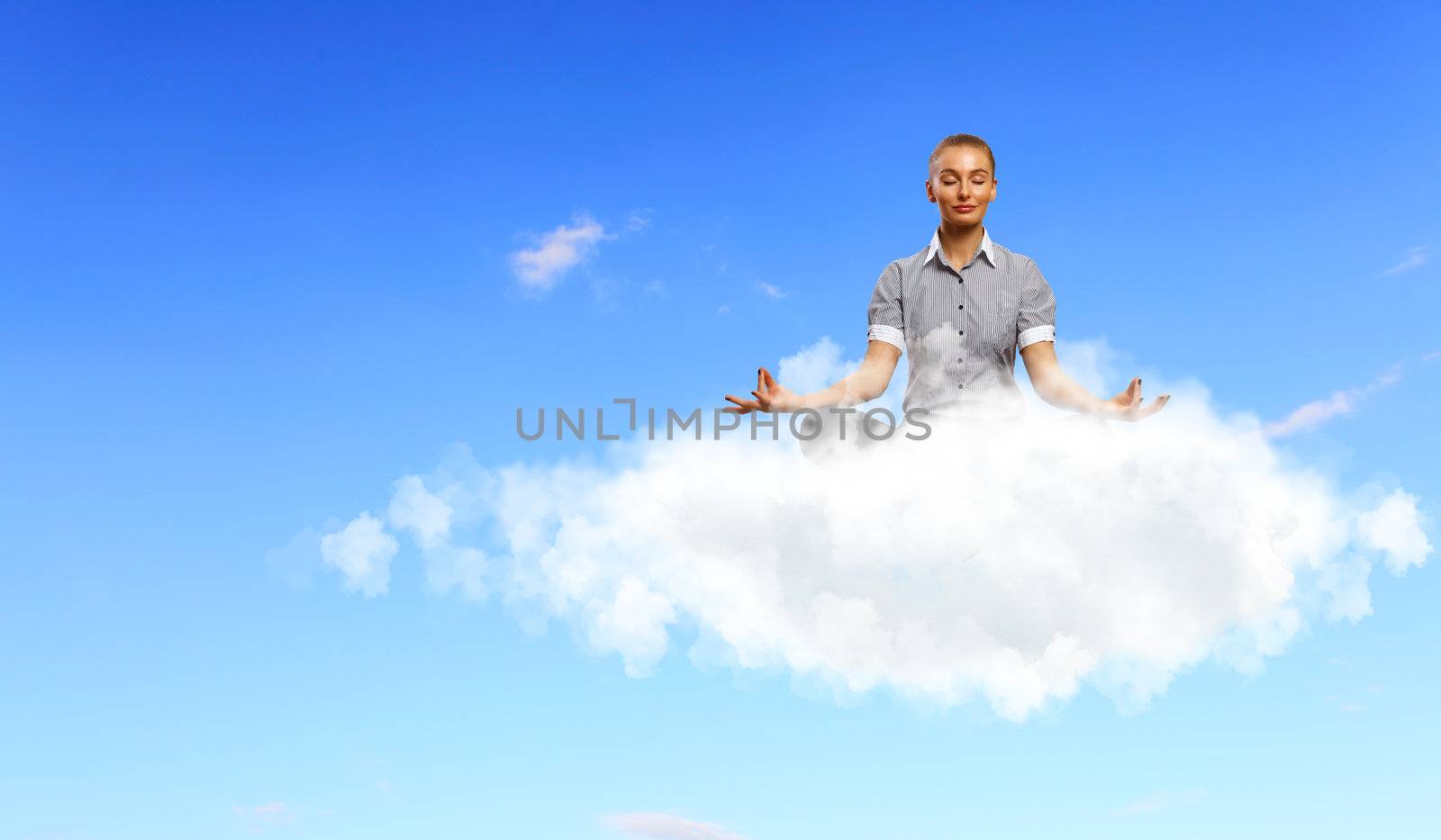 Businesswoman meditating sitting on the cloud by sergey_nivens