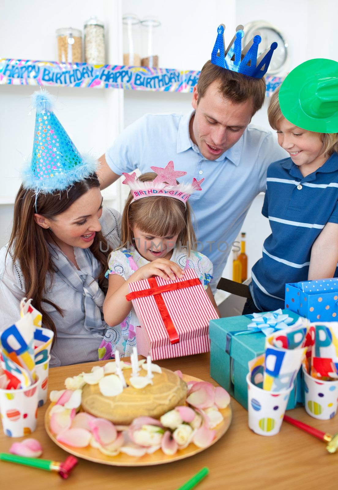 Smiling little girl celebrating her birthday by Wavebreakmedia