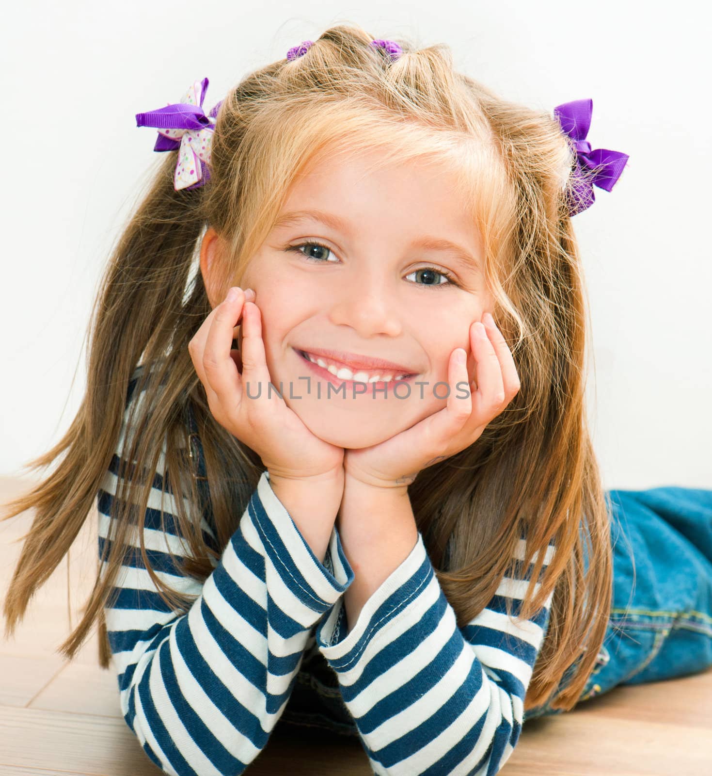 little smiling girl looking at the camera