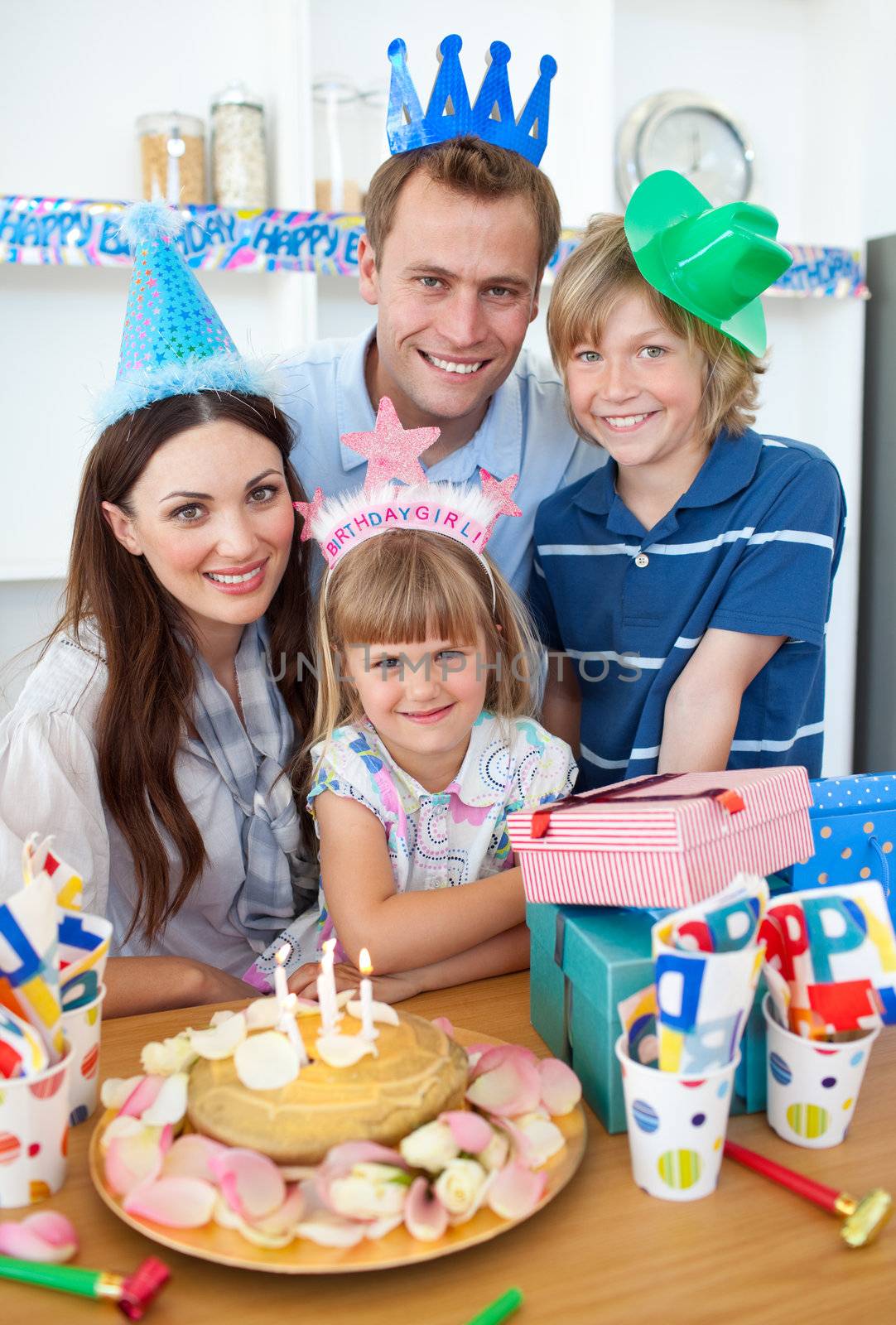 Adorable little girl celebrating her birthday in the kitchen