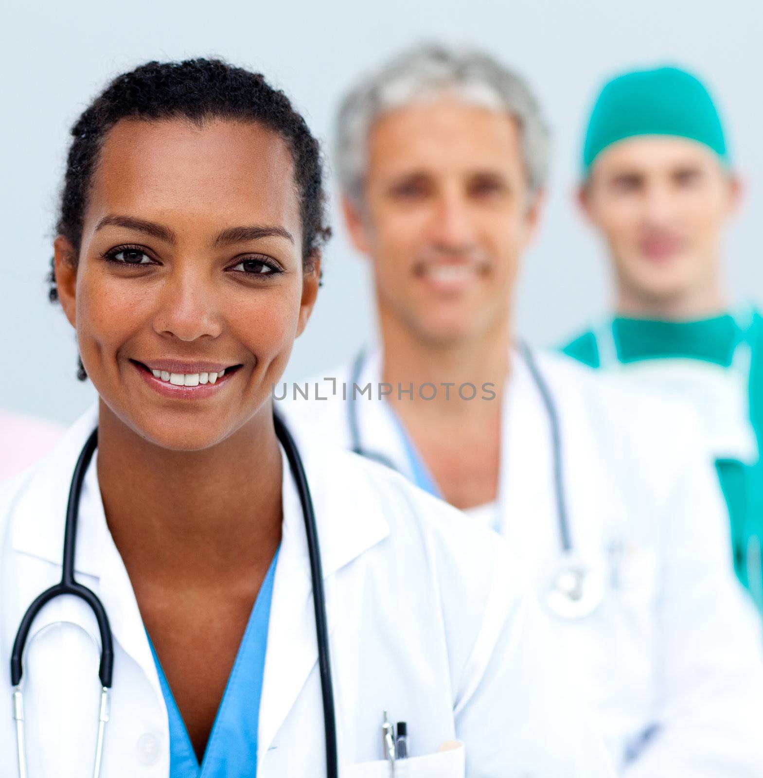 Attractive female Doctor standing before her team