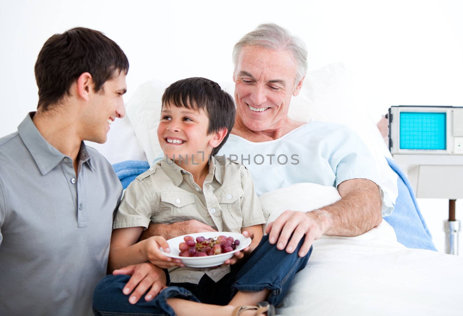 Smiling father and his son visiting grandfather by Wavebreakmedia