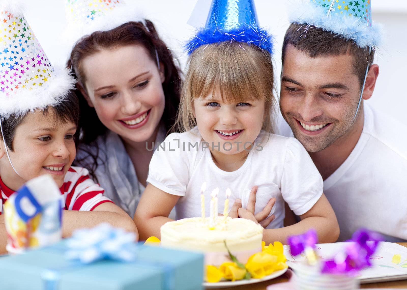 Parents and children celebrating a birthday by Wavebreakmedia
