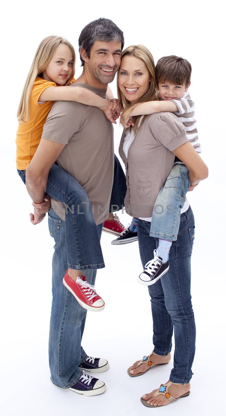 Family giving children piggyback ride by Wavebreakmedia
