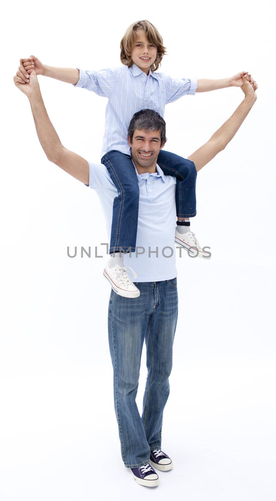 Father giving son piggyback ride by Wavebreakmedia