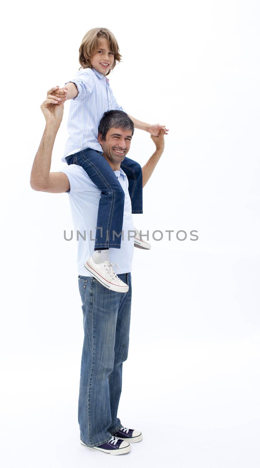 Dad giving little boy piggy back ride against white background