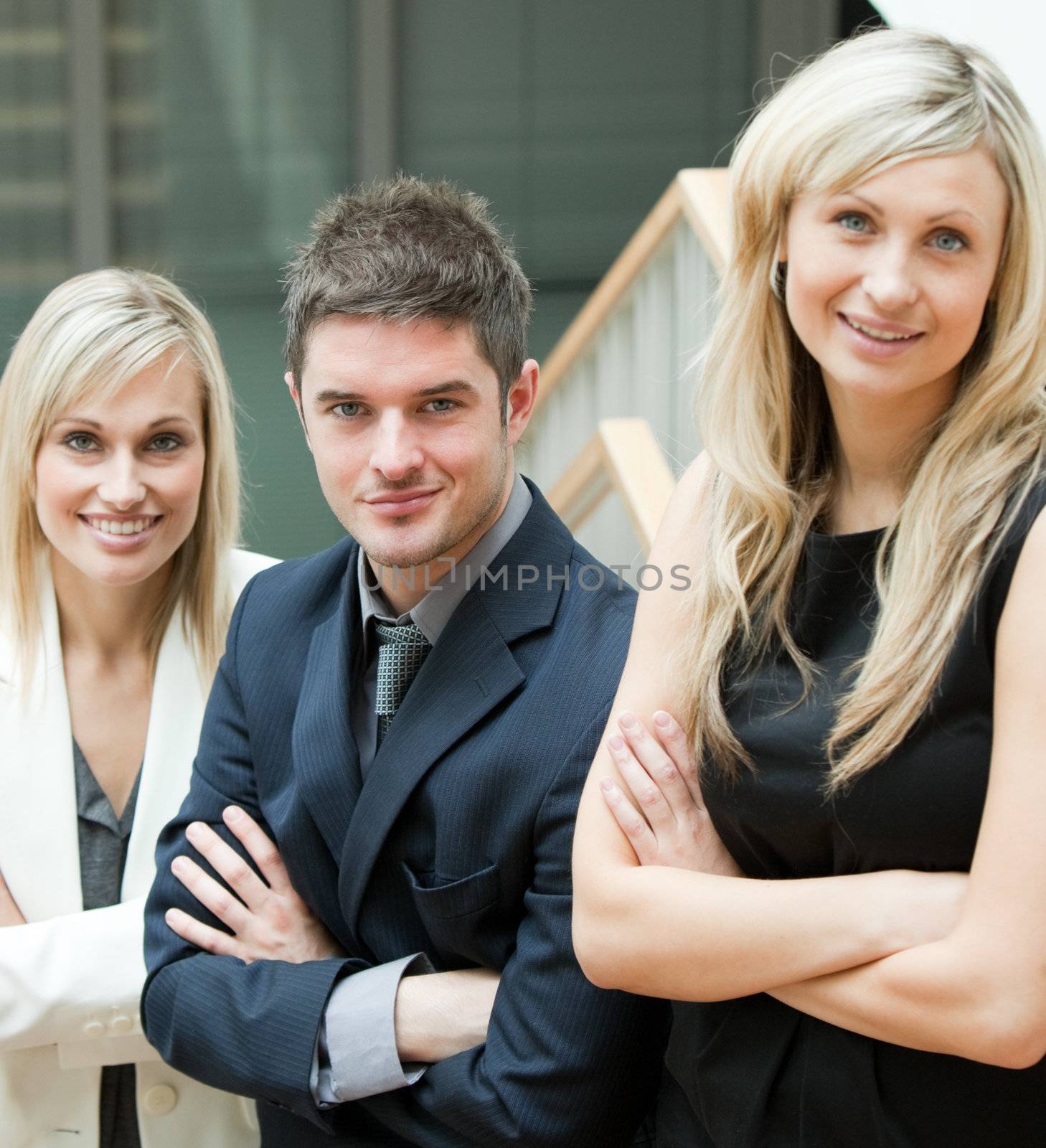 Young Business People with folded arms on stairs