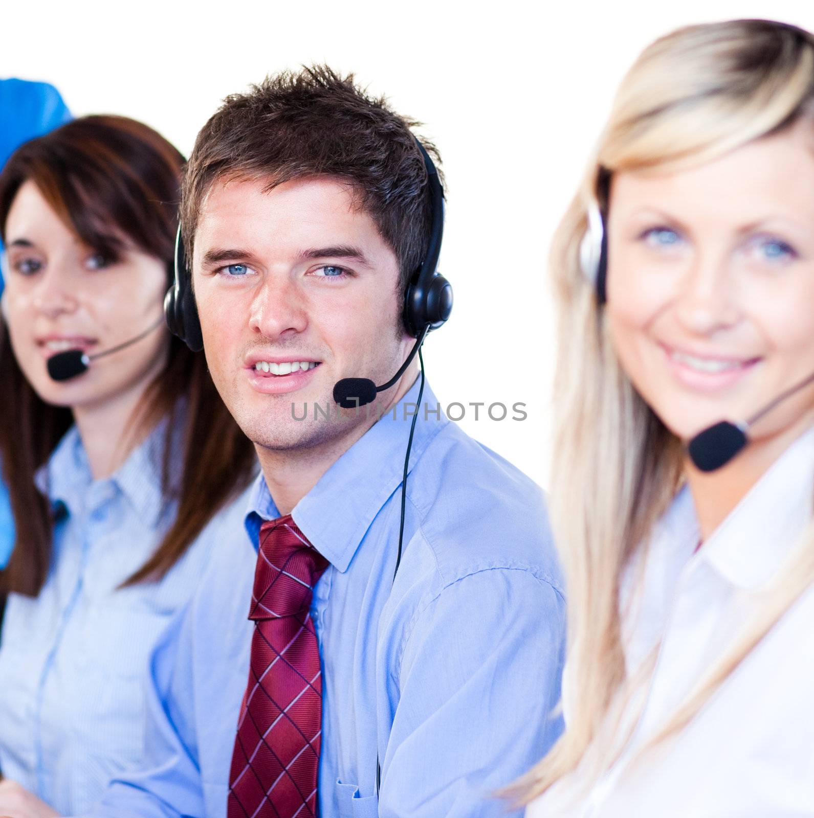 Young businessman with his colleagues in a call center 