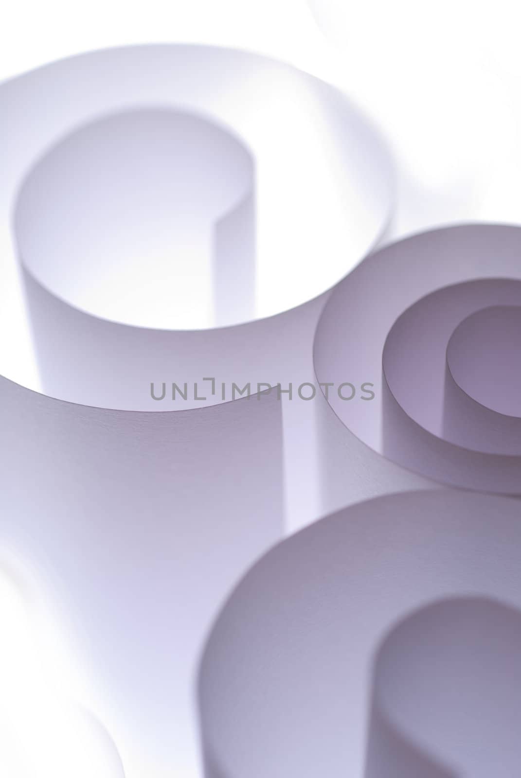 Paper curls in A4 size overexposed in studio