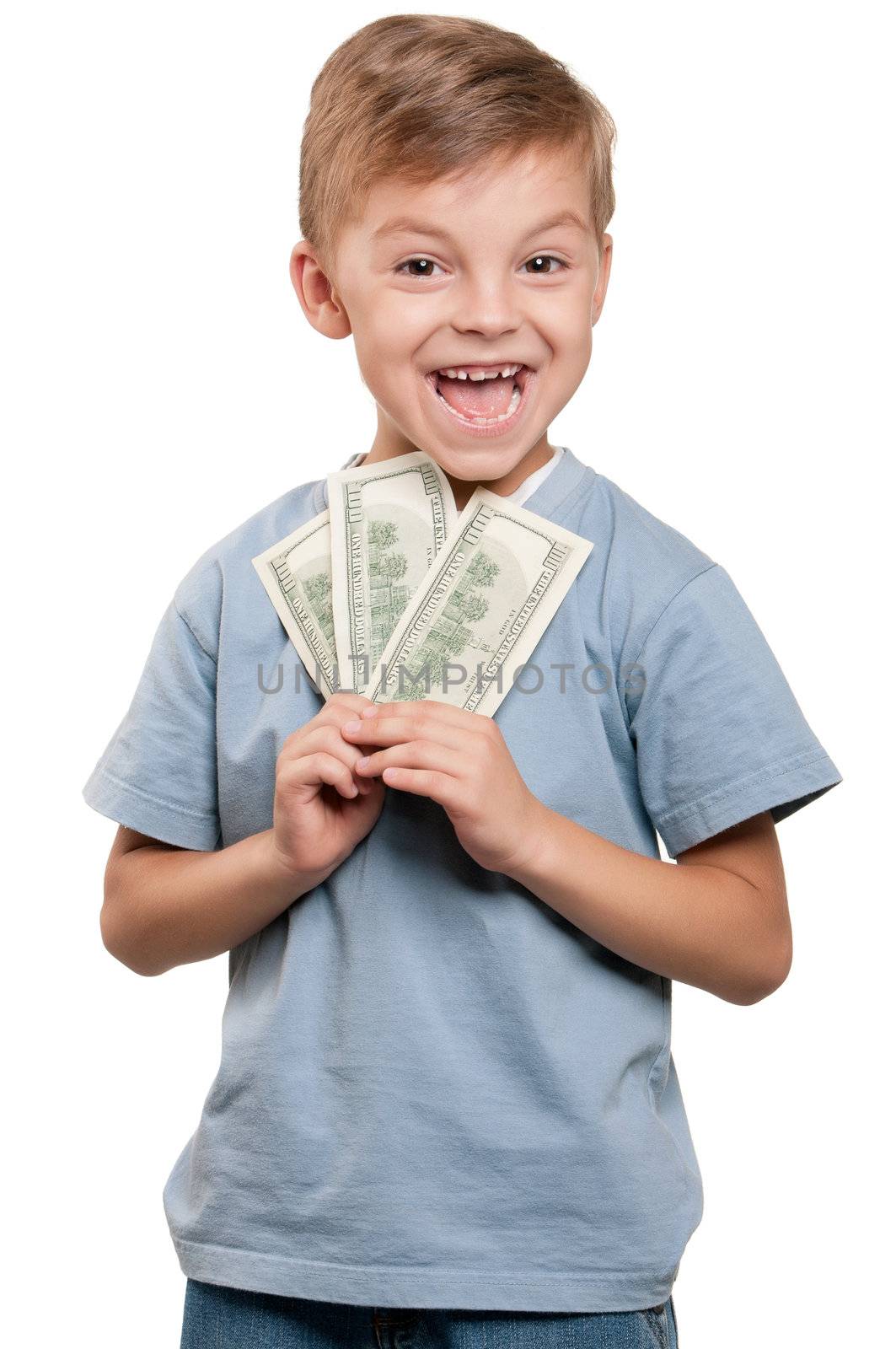 Portrait of a cheerful little boy holding a dollars over white background