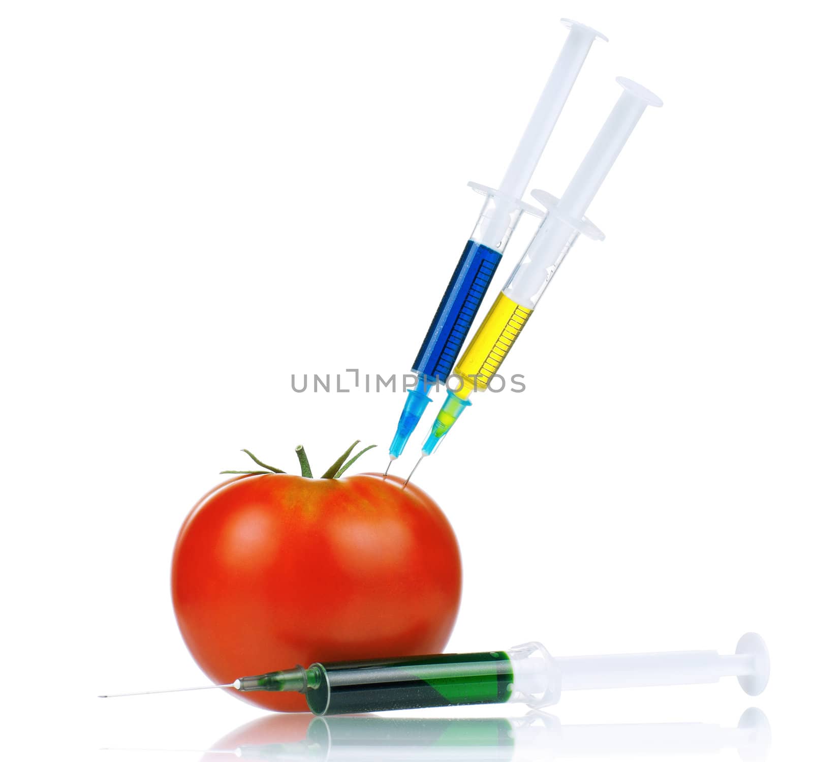 Genetically modified organism - ripe tomato with syringes on white background