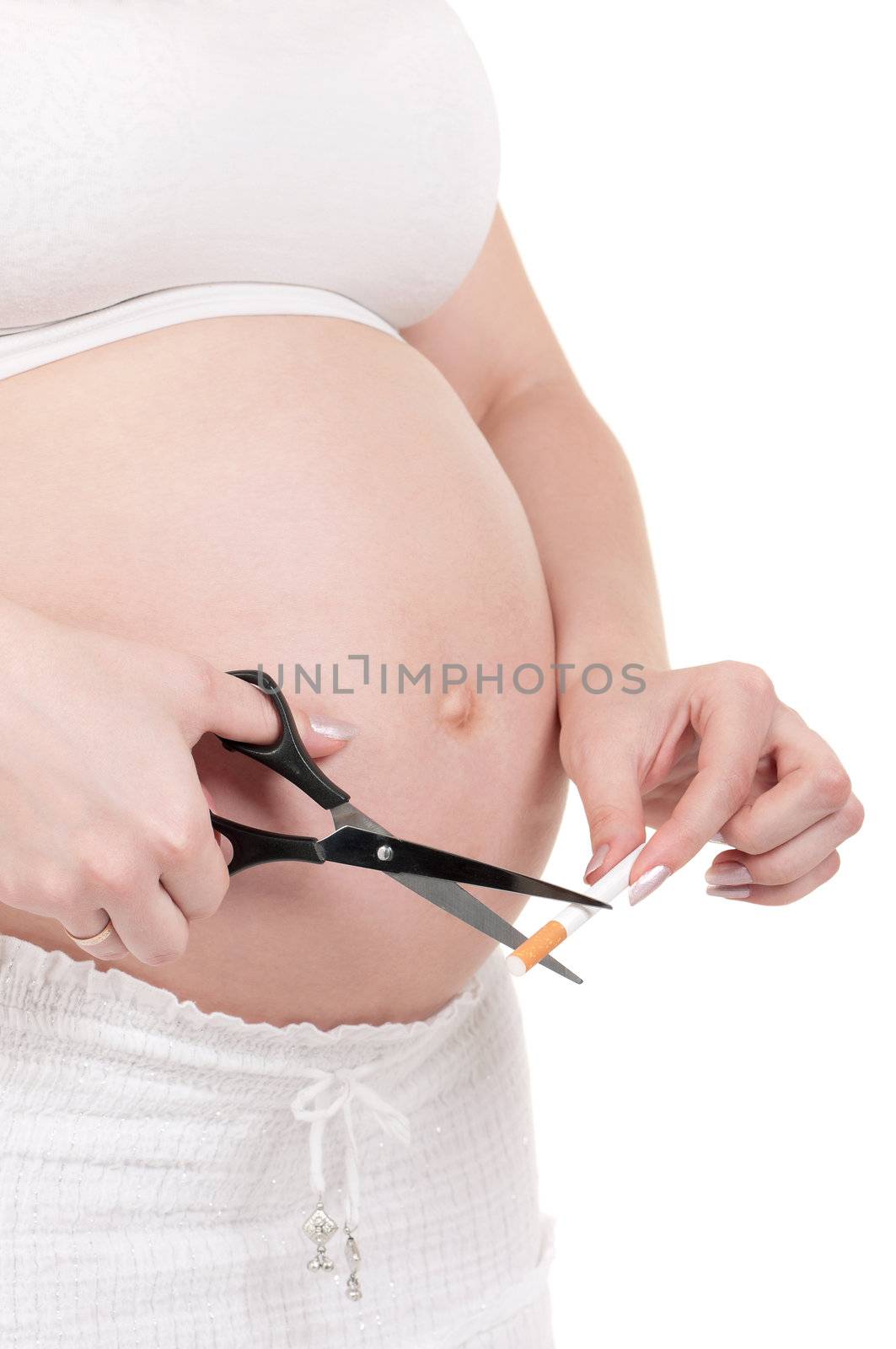 Pregnant belly with cigarettes by fotostok_pdv