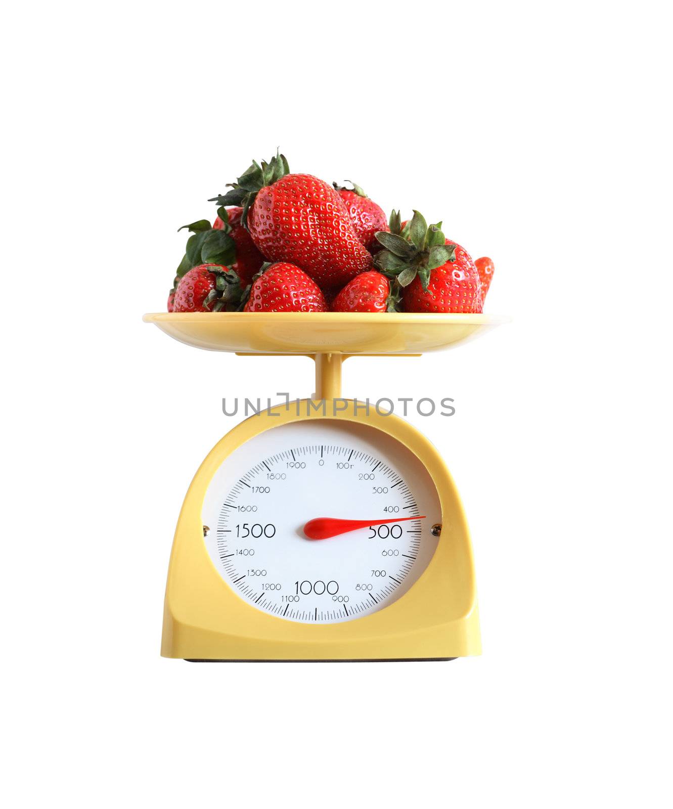 Heap of strawberry fruits lying on nice yellow kitchen scale. Isolated on white with clipping path