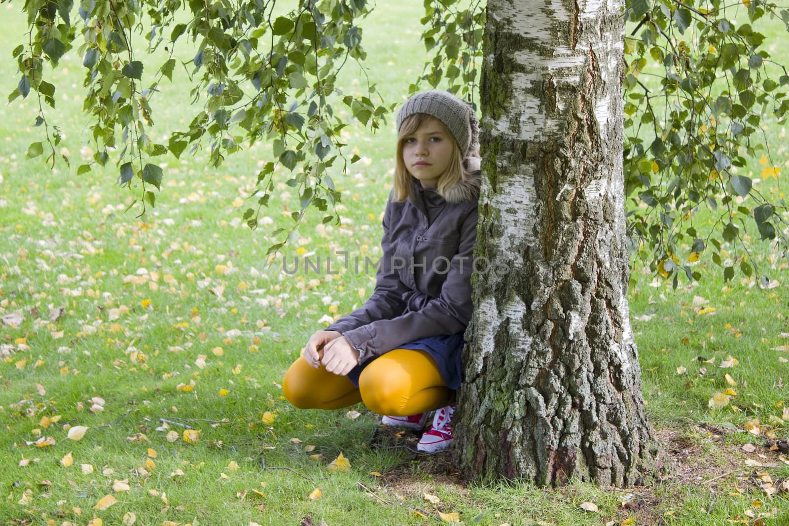 Cute girl in autumn park