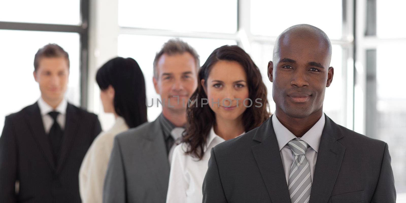 Business team looking at camera and smiling 