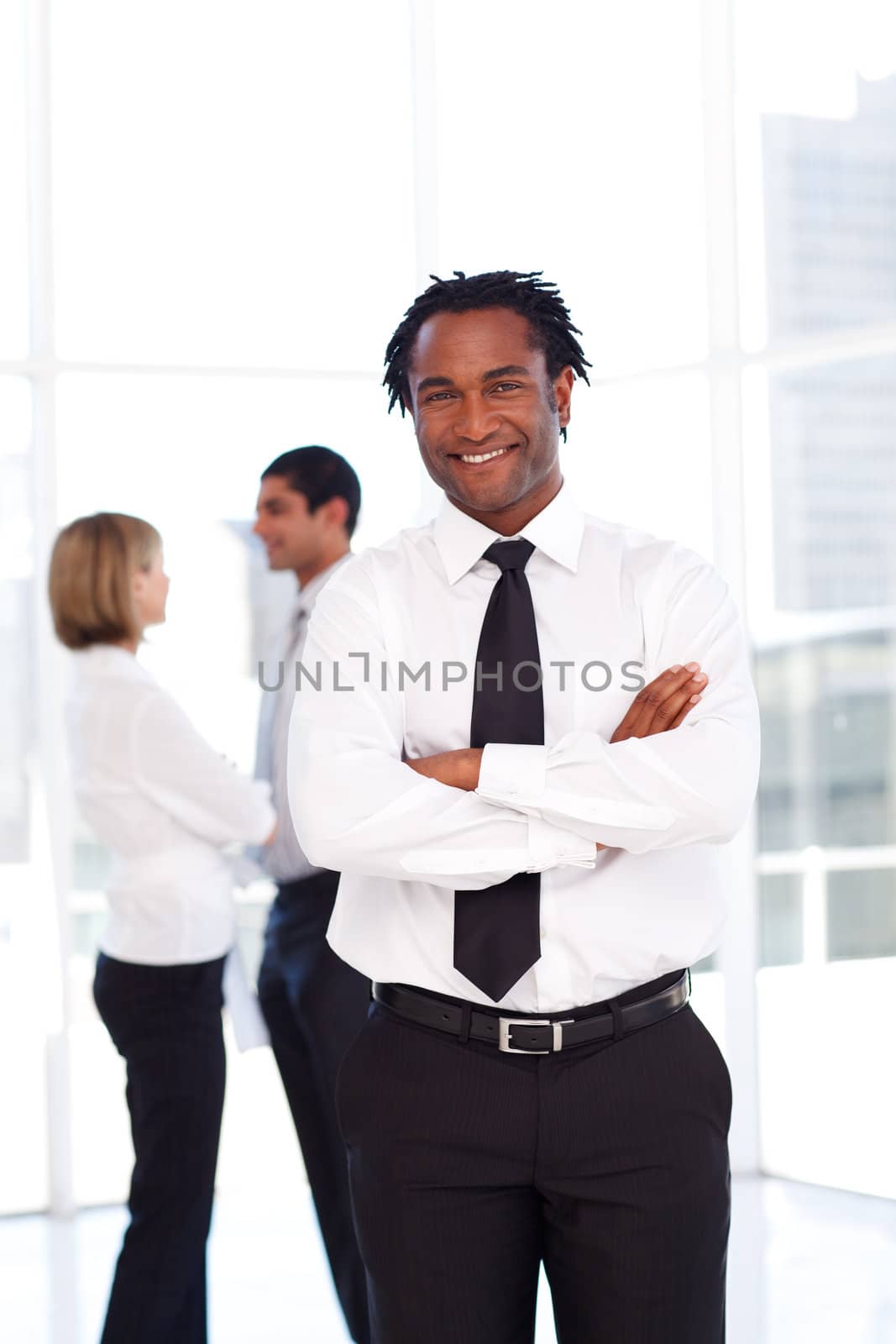 Confident African businessman smiling at the camera by Wavebreakmedia
