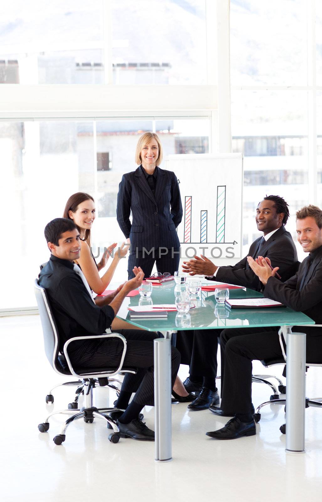 International business people clapping in a presentation