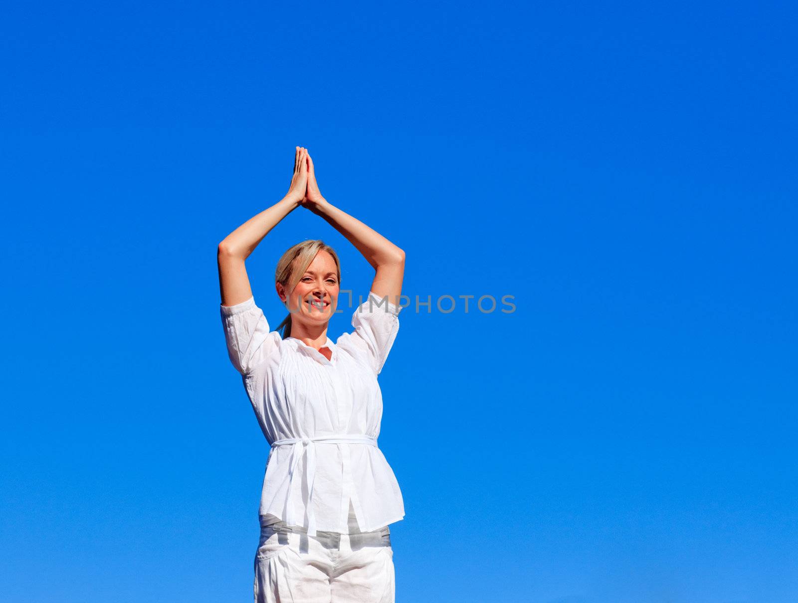 Young woman practising meditation by Wavebreakmedia