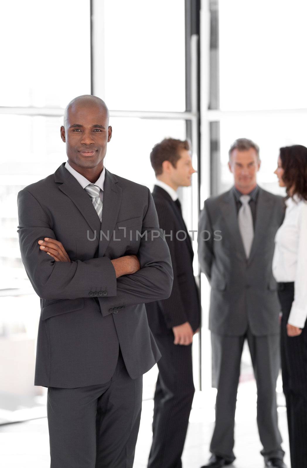 Young Businessman standing out from the Crowd by Wavebreakmedia