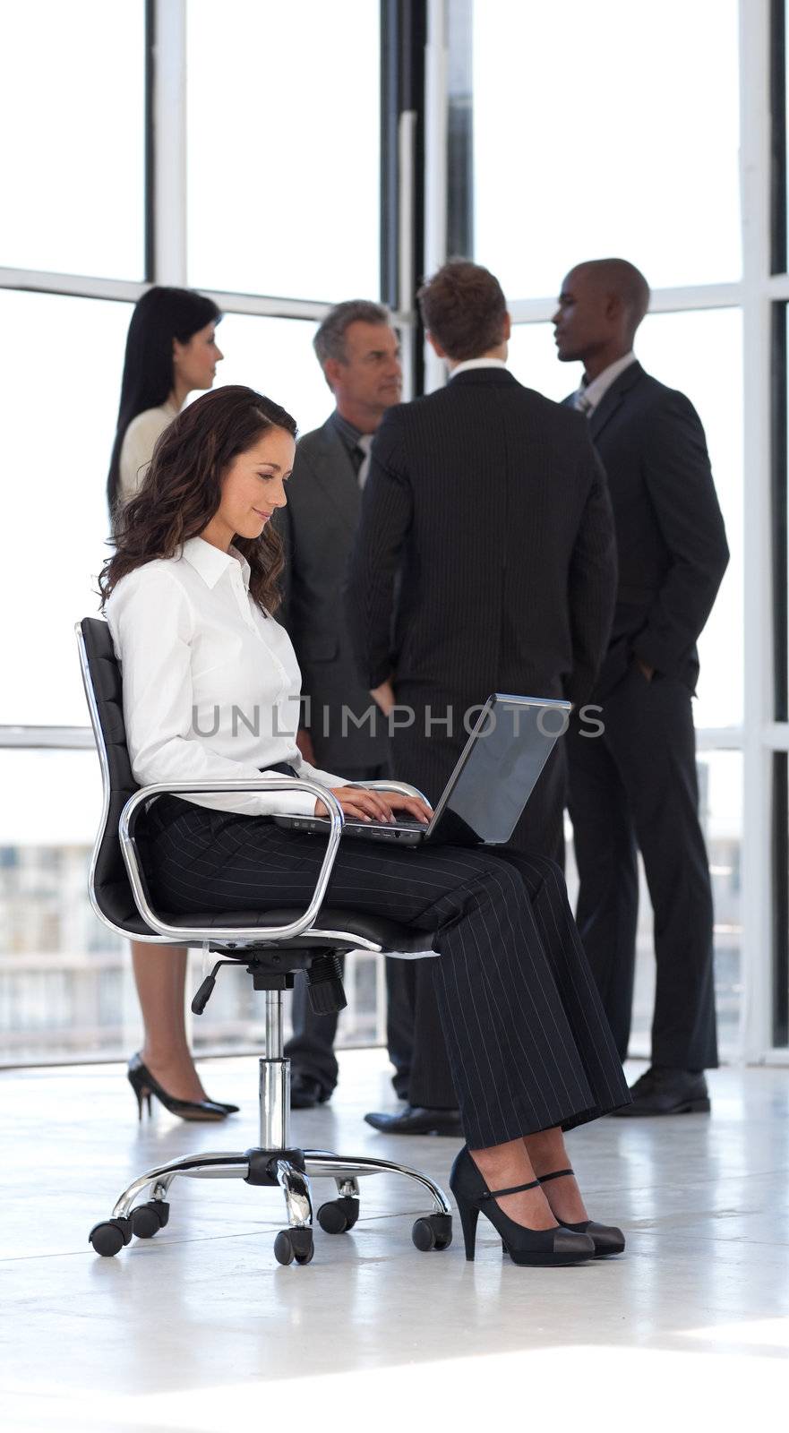 Young attractive businesswoman in office working 2