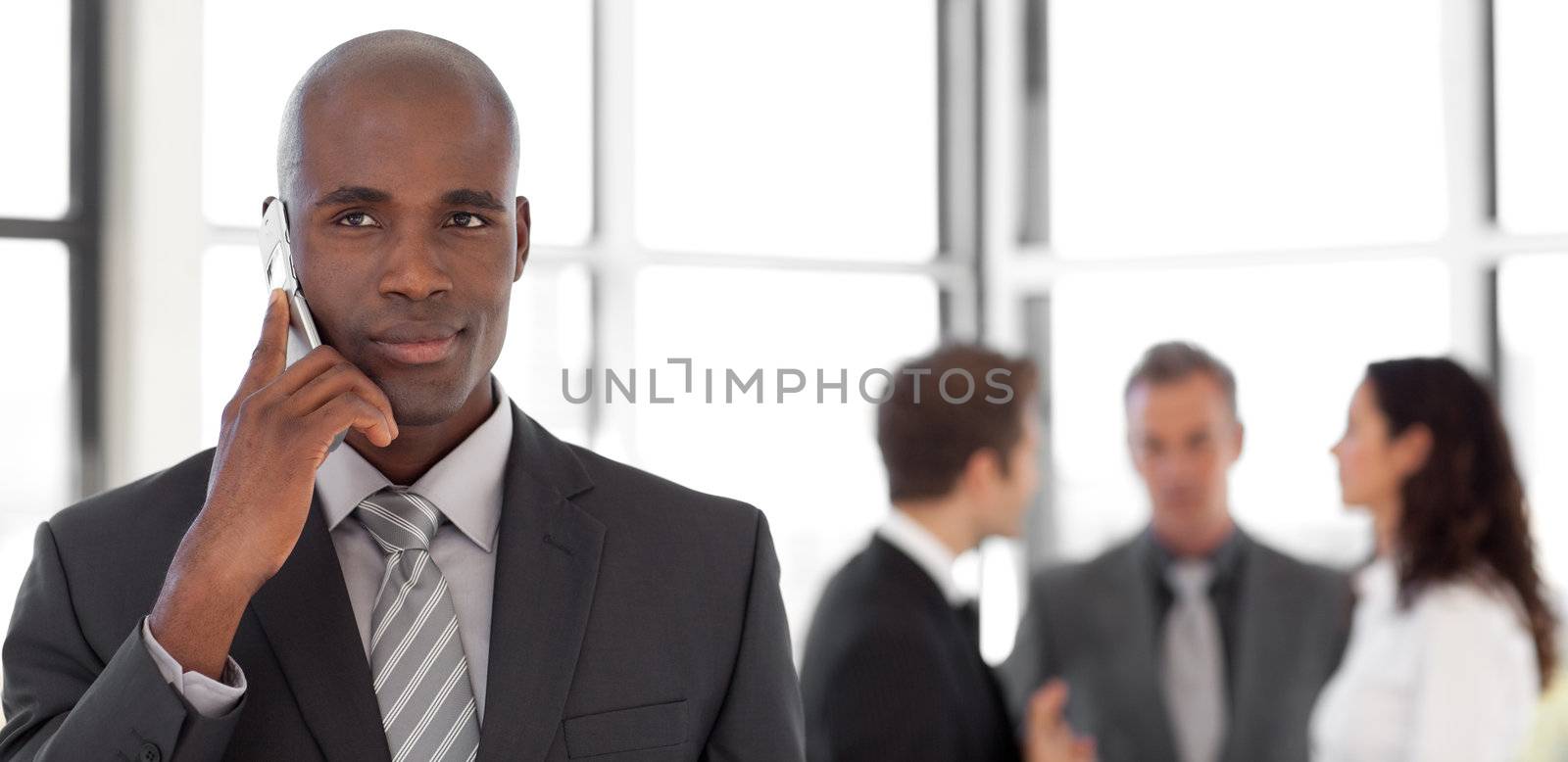 Businessman talking on cellphone by Wavebreakmedia