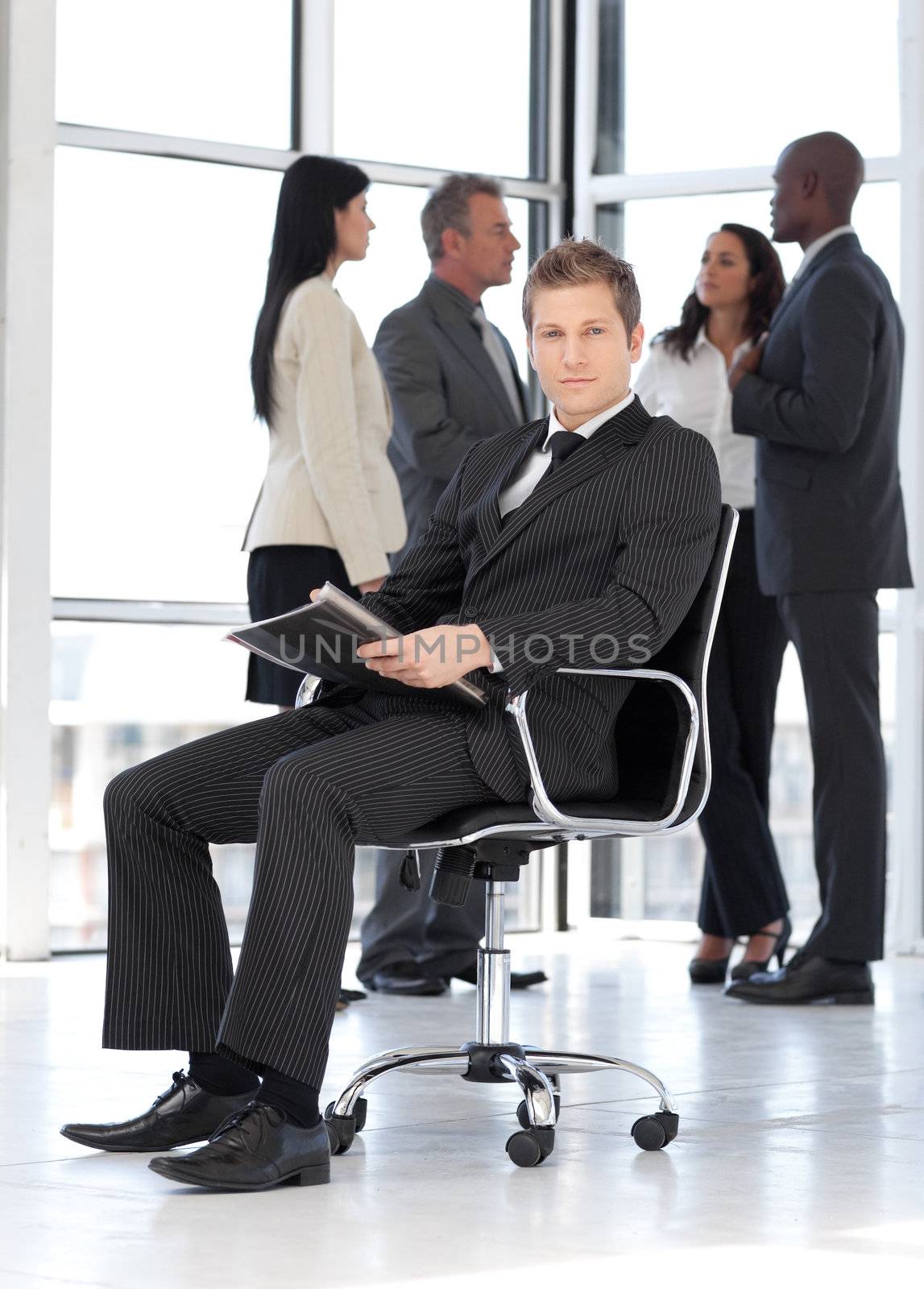 Young attractive businessman in office working  by Wavebreakmedia