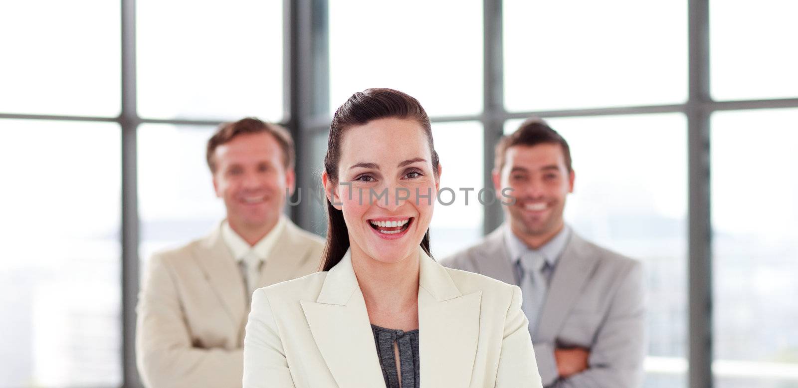 Attractive confident young businesswoman in office