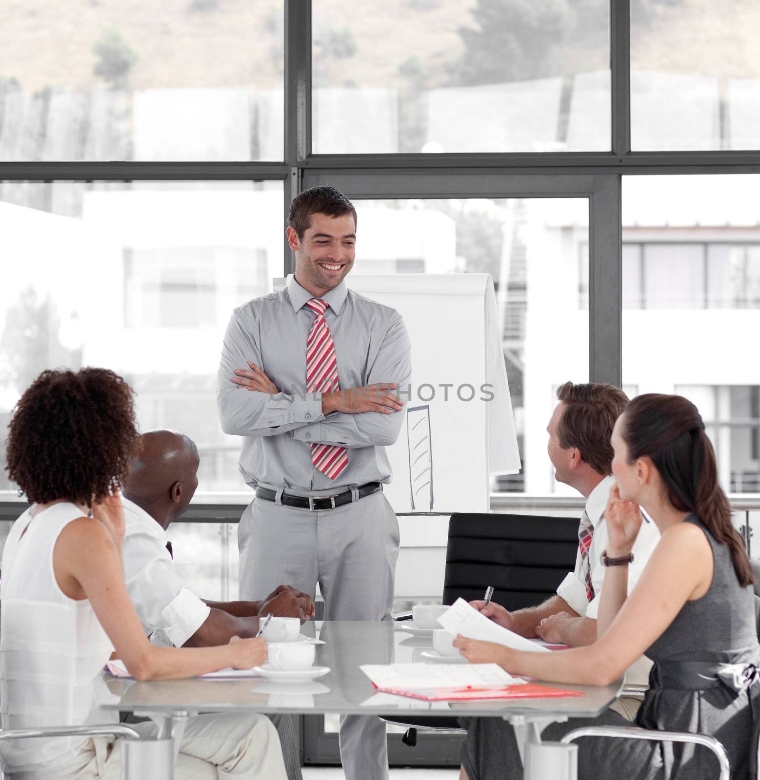 Young Attracitve Businessman giving a presentation