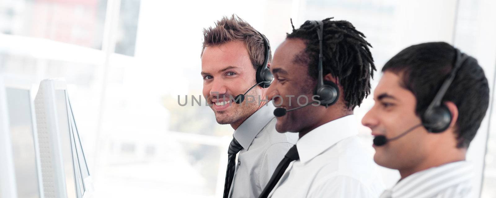 International business team in a call center wearing headset