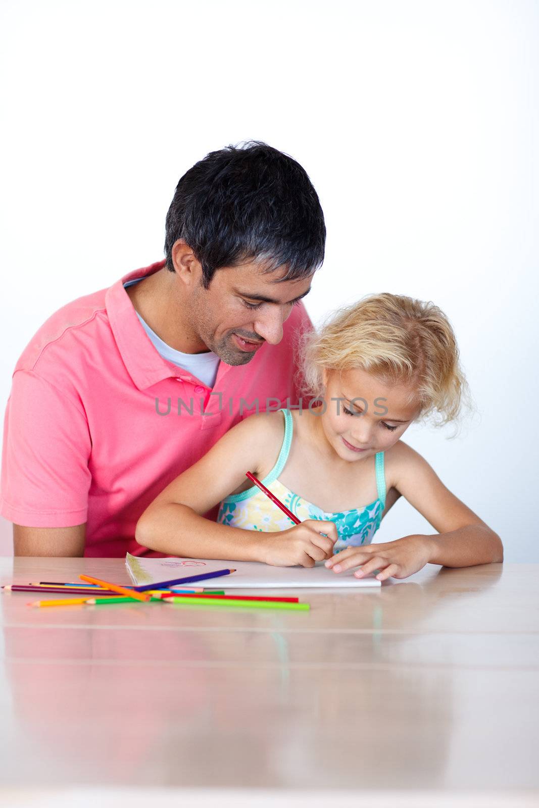 Beautiful daughter painting with her father at home