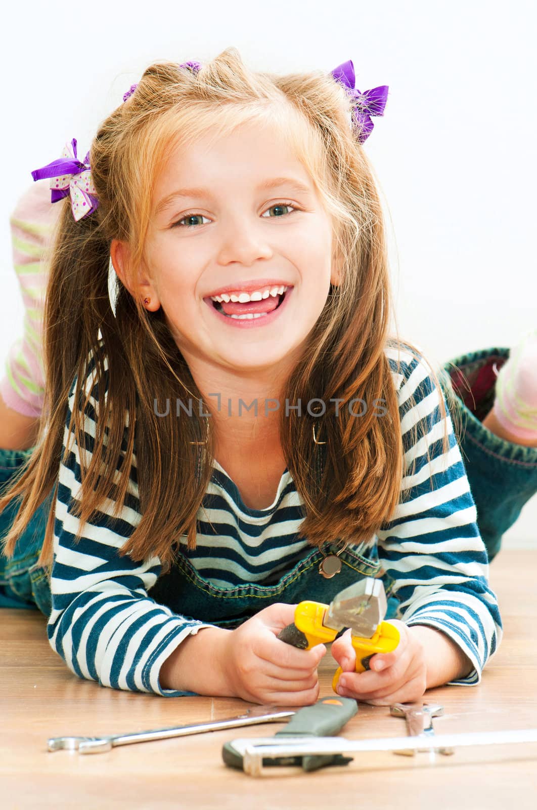 little smiling girl with tools