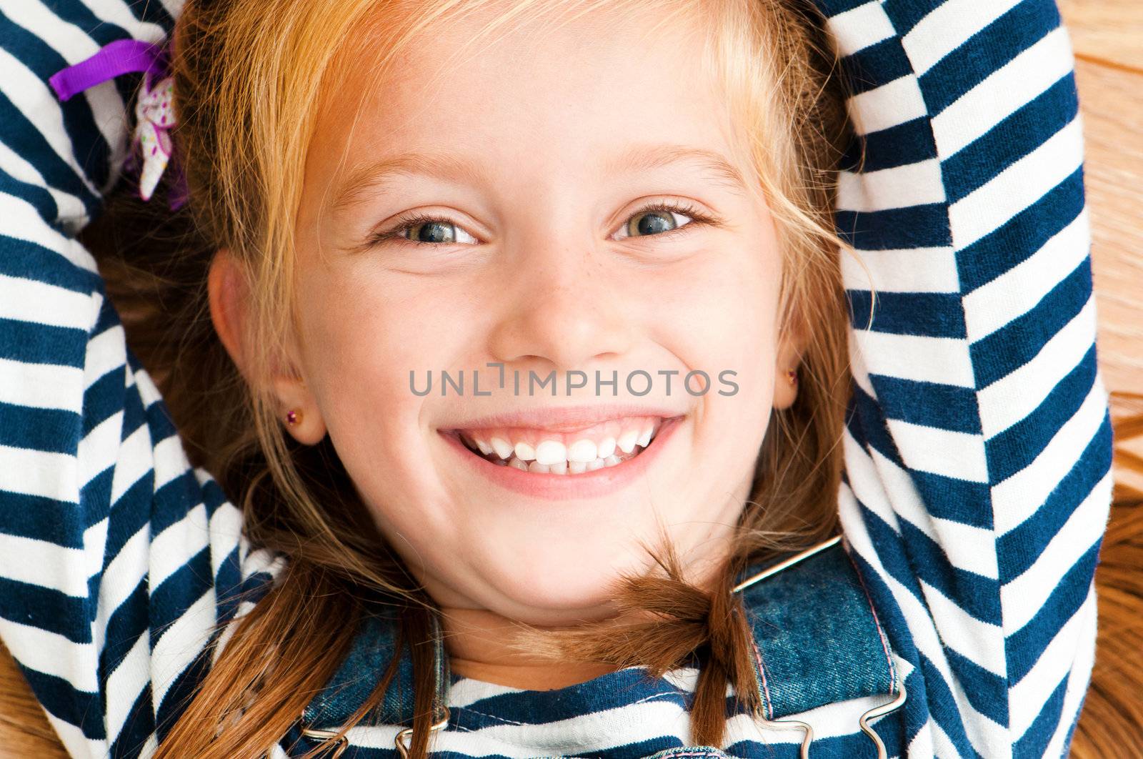 cute smiling girl looking at the camera