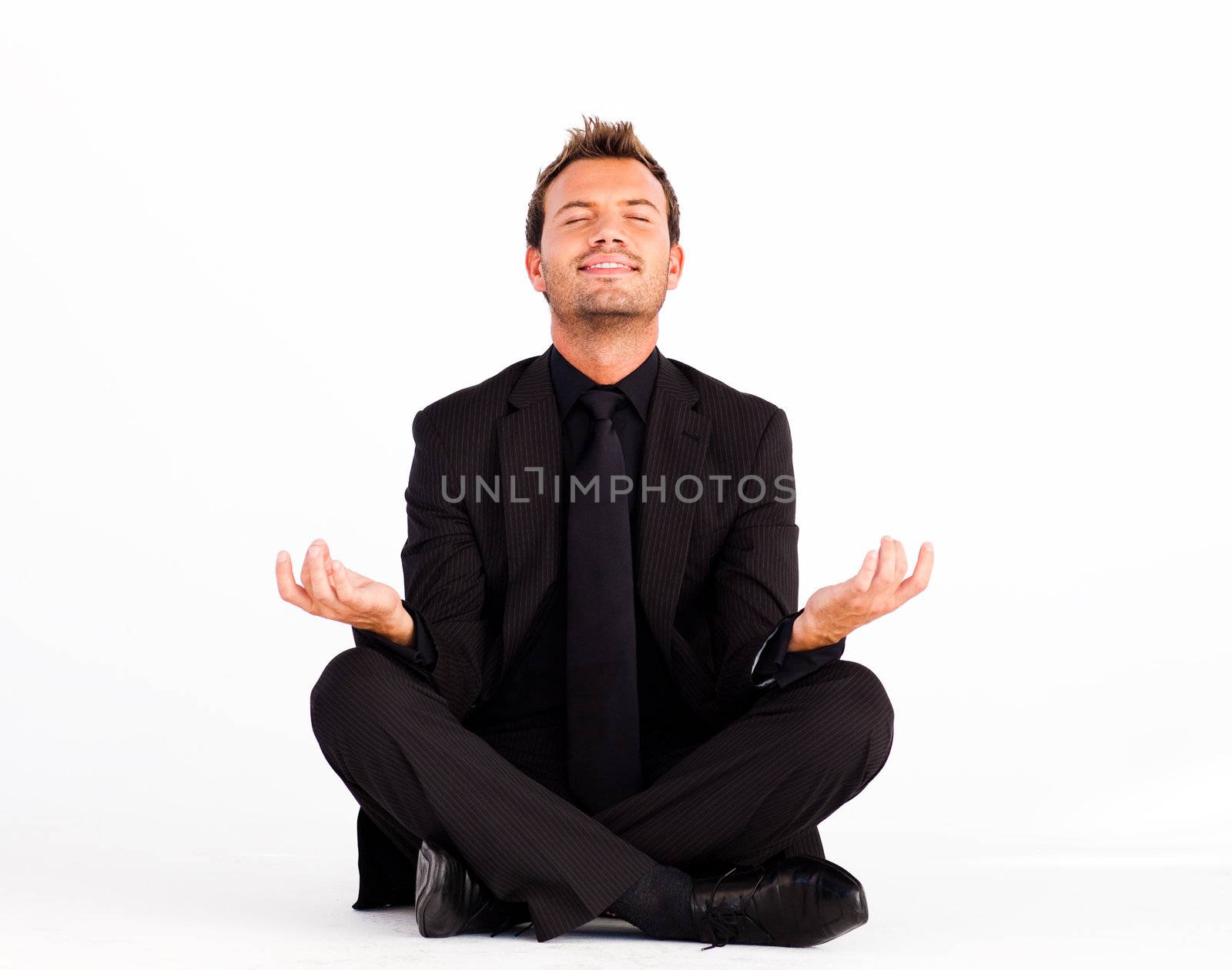 Smiling man doing yoga exercises by Wavebreakmedia