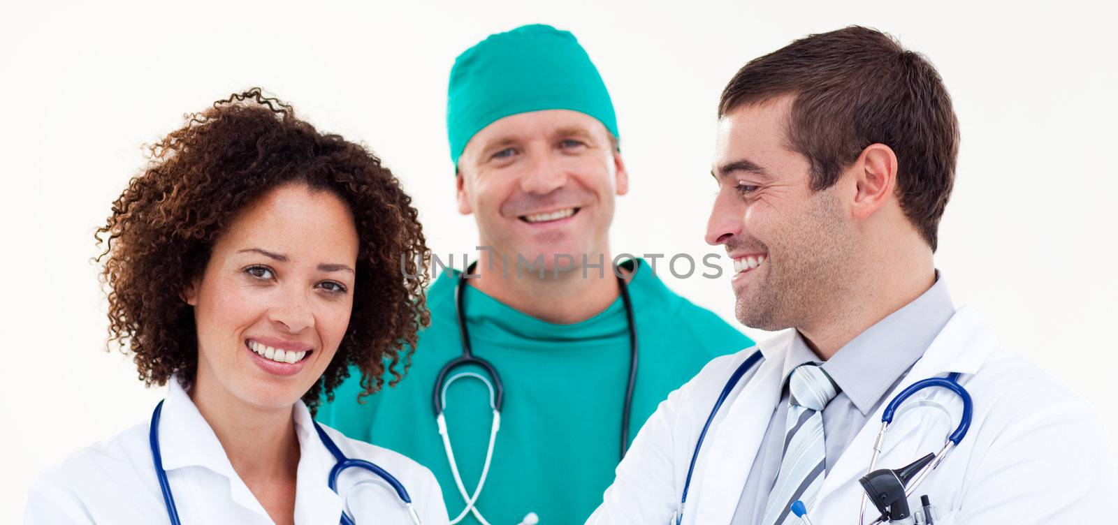 Group of smiling doctors looking at the camera at the hospital