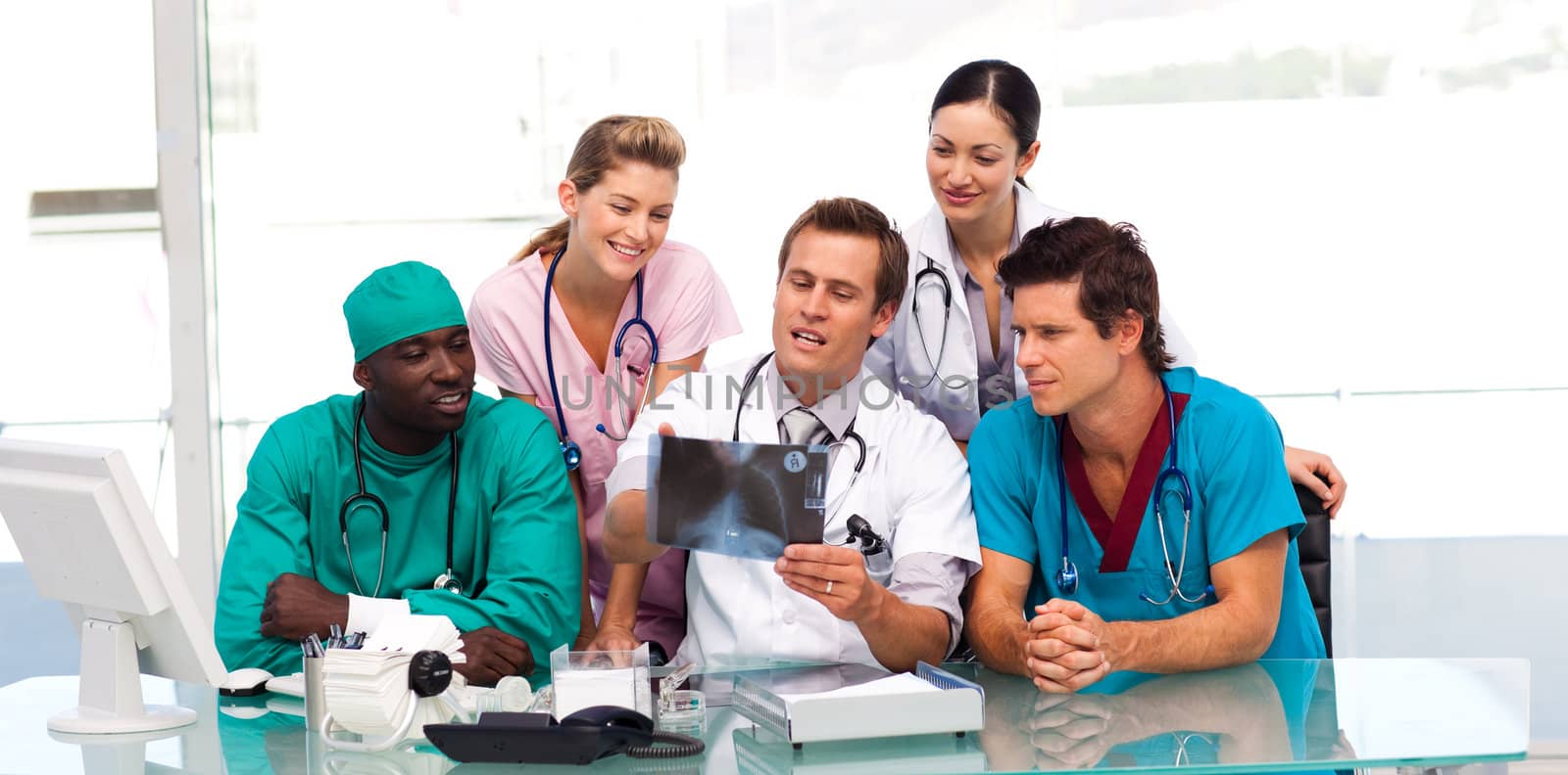 Group of doctors examining an X-ray in hospital