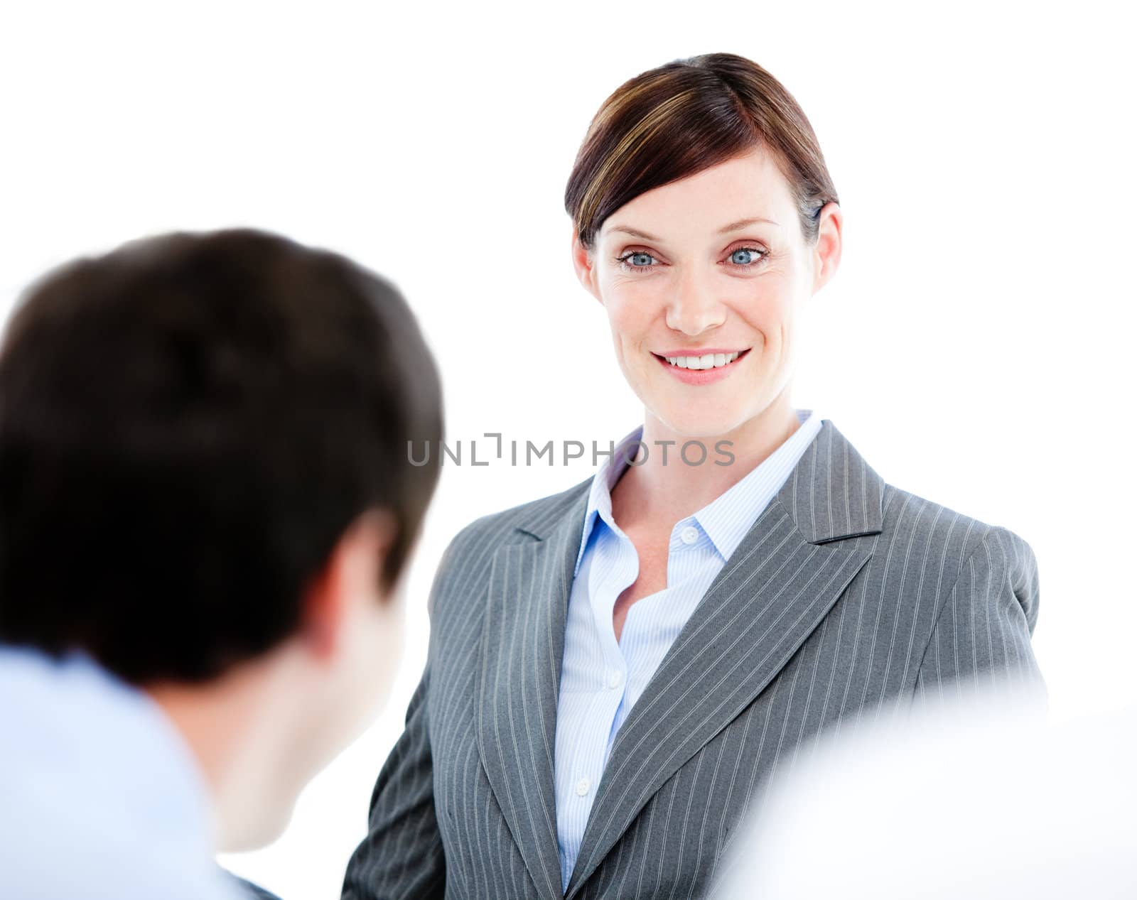 Portrait of a confident businesswoman talking at her colleague during a meeting in the office 