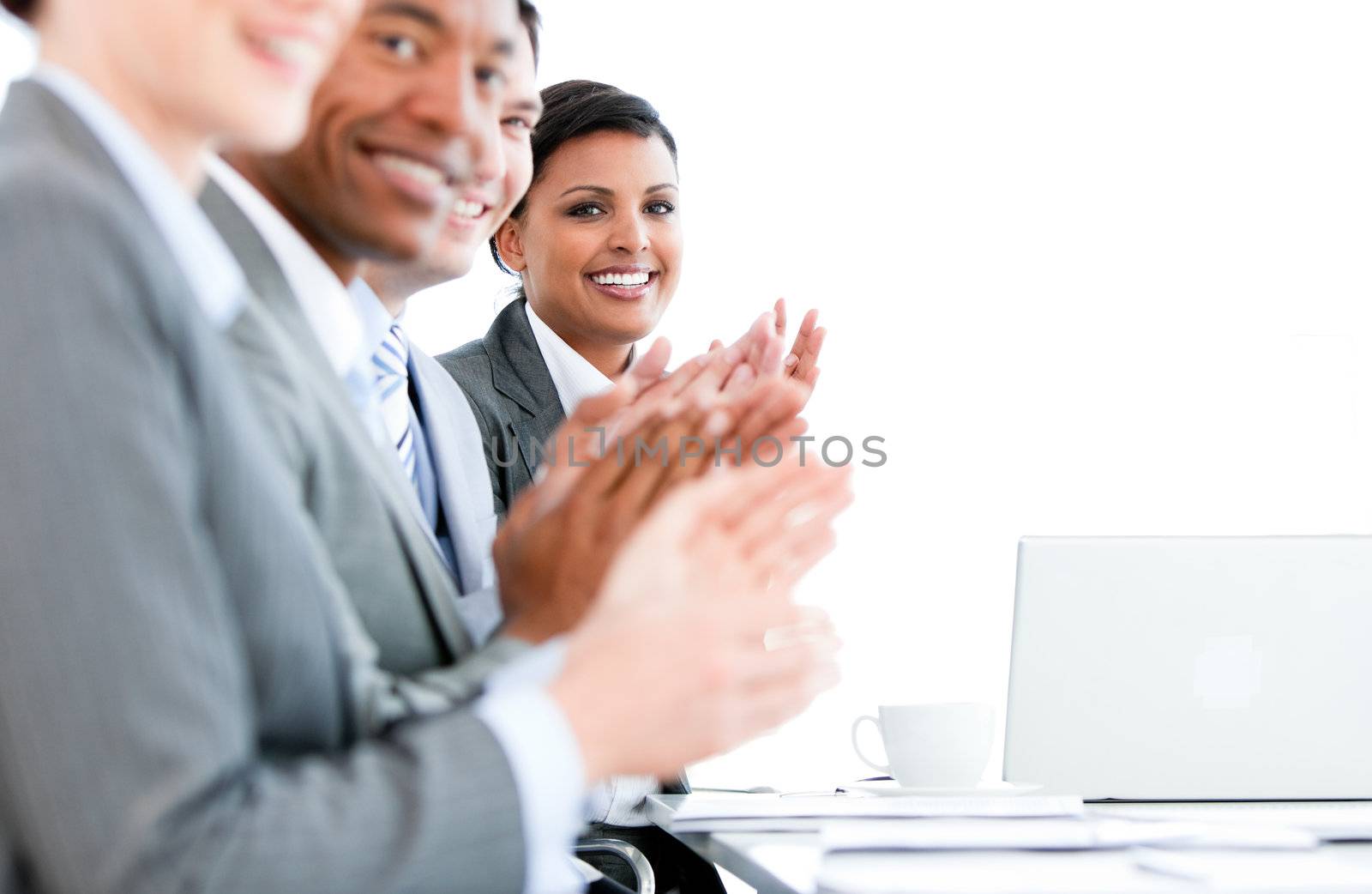 Close up of a multi-ethnic business team applauding a presentation in the office