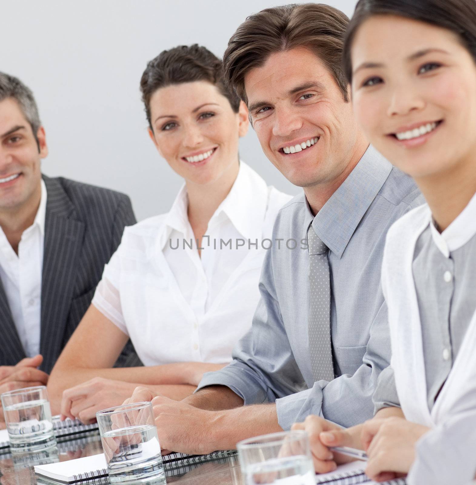 International business people sitting around a conference table. Business concept.